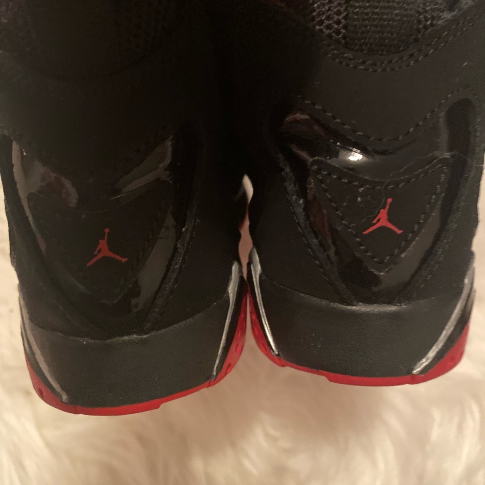 Jordan’s girl or boy. Red and black. Size 1.
